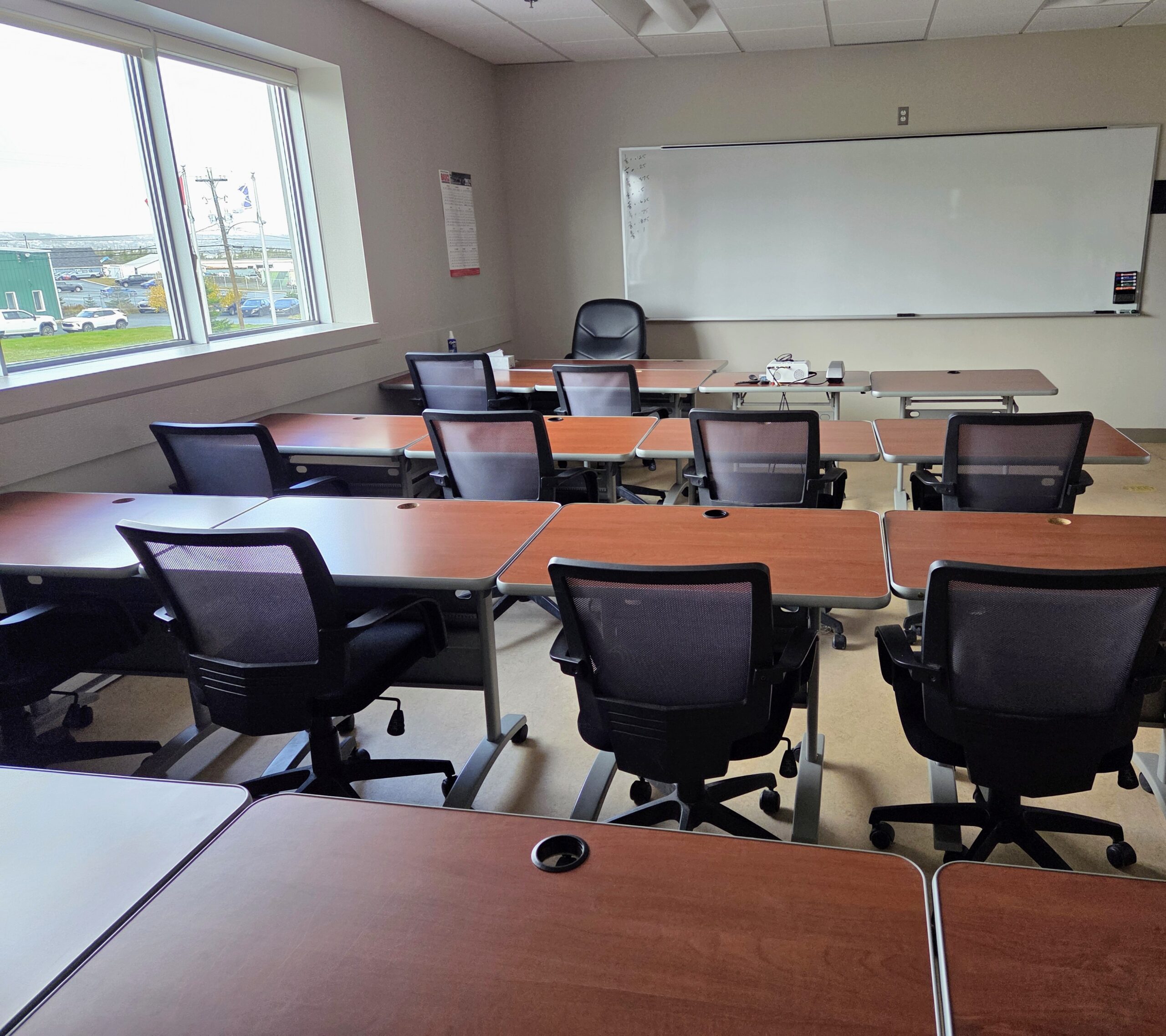 Construction worker in safety gear adjusts scaffolding while wearing gloves, a hard hat, and a mask at a building site.